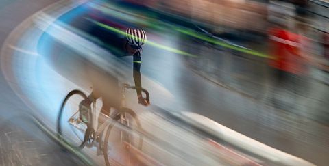 Blurry photo of a cyclist on a road bike